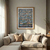 A framed art print featuring a detailed aerial-style photograph of a dense row of houses in Copenhagen, called Potato Rows, in a brown frame set in a living room.