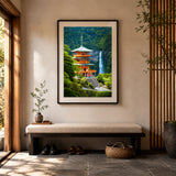A framed art print depicting a Japanese pagoda and waterfall in lush green scenery at Nachi Falls, displayed on a beige wall above a wooden bench in a modern, sunlit entryway.