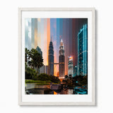 Framed wall art featuring a colorful city skyline with the Petronas Towers at dusk, shown in a white frame against a light gray background.