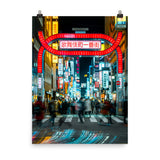 A photographic print featuring people walking in Shinjuku Tokyo at night and neon signs in the background.