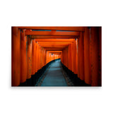 Unframed wall art featuring a tunnel of red orange torii gates in Kyoto, Japan