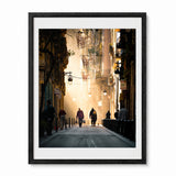 A framed barcelona street photograph print, presented in a black wood frame. 
