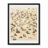 A framed art print depicting a crowded Bondi beach scene with tiny figures of people, umbrellas, and beach gear on a sandy beige background, presented in a black frame with a white mat.