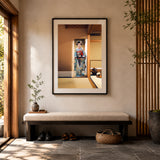 Photograph of a Japanese geisha set in a black frame in a hallway of a home