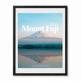 Framed wall art featuring mount fuji reflected over water and decorative text showing the word "Mount Fuji" and the coordinates presented in a black frame.