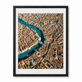 A framed aerial photograph of Venice, showcasing the winding blue Venetian Canal surrounded by dense orange-brown buildings, presented in a black frame with a white mat on a light gray background.