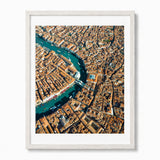 A framed aerial photograph of Venice, showcasing the winding blue Venetian Canal surrounded by dense orange-brown buildings, presented in a white wood frame.